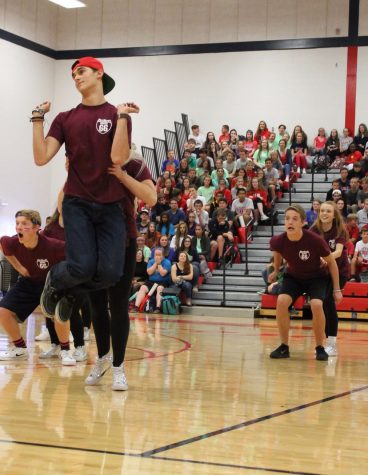 Patrick Stege (back) and Evan Fuhremann (front) show off their dance moves during the assembly