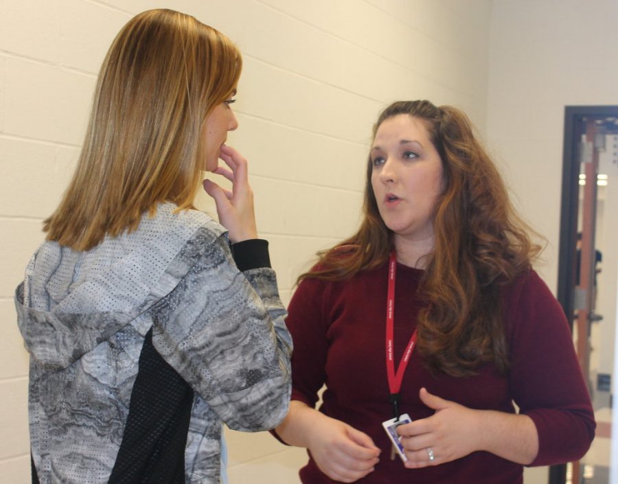 On her second week as theater director, Mrs. Willis helps student Zoe Killingsworth with her work.