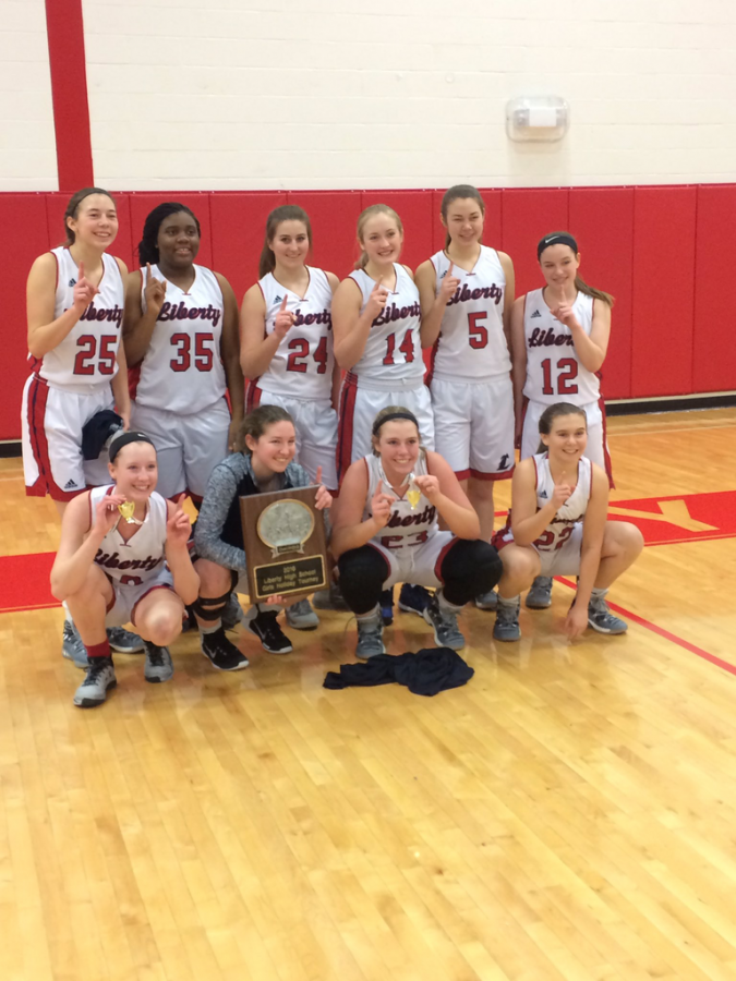 Lady Eagles after the Winter Classic Tournament with their first place plaque. 