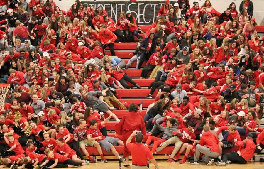 The+student+section+parts+the+Red+Sea+for+Moses+%28Drew+Schill%29+to+walk+up+the+middle.
