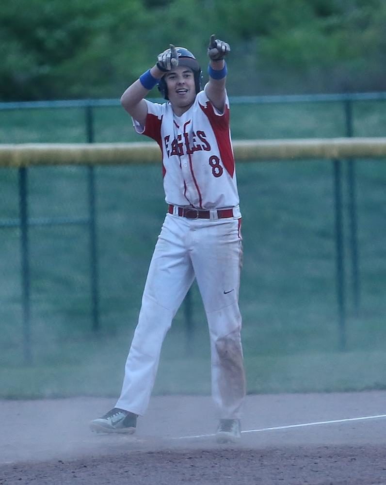 Sophomore+Dillon+Hebbeln+points+back+to+the+dugout+after+his+triple.