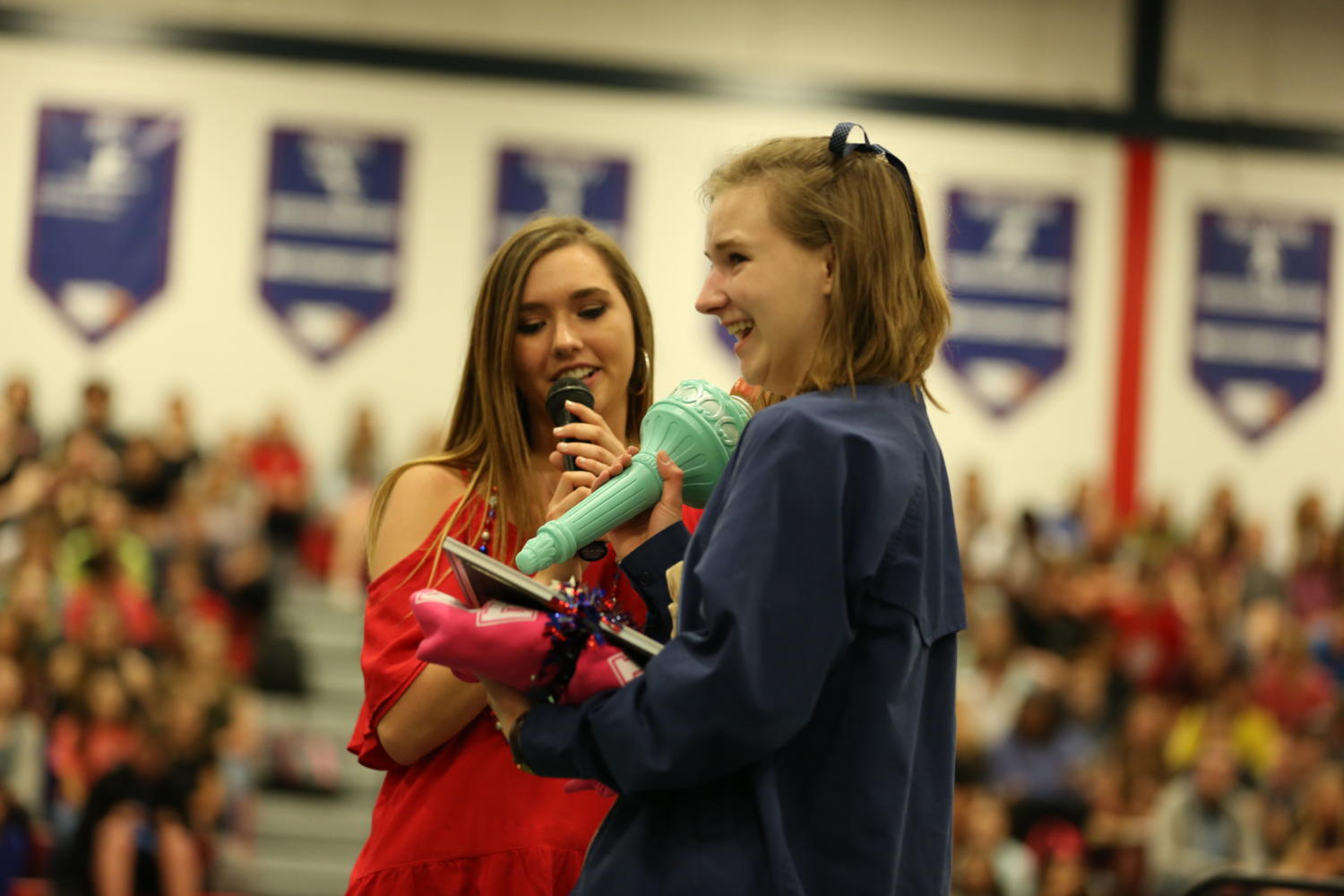 Senior Danielle Corgan and junior Emma Ingle share a moment as the Lady Liberty legacy is passed down.