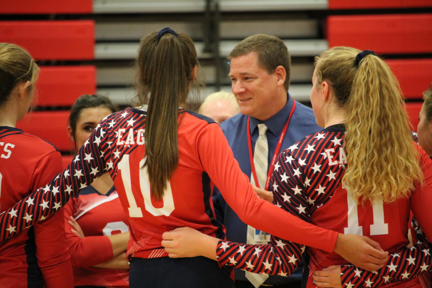 Head varsity volleyball Coach Egbert makes sure the girls heads are in the game against Fort Zumwalt North. The eagles ended up winning the two sets.