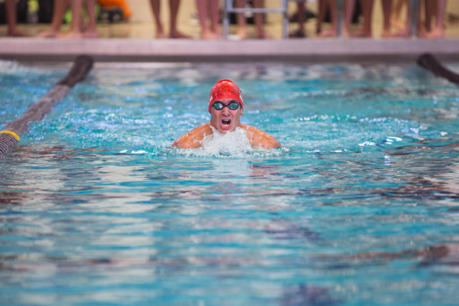 Junior Ian Herling takes a breath as he pushes to the finish. Herling placed fifth at state in the 50-meter freestyle. “This is my second year making state and I’m excited but always nervous,” Herling said.