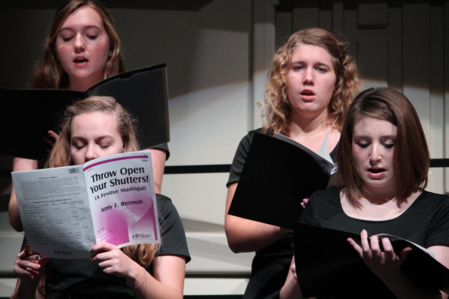 Mykaela Reiland, Shaina Feinstein, Jen Deters and Ruthie Clancy of treble select sing "Throw Open Your Shutters" at the winter concert. 