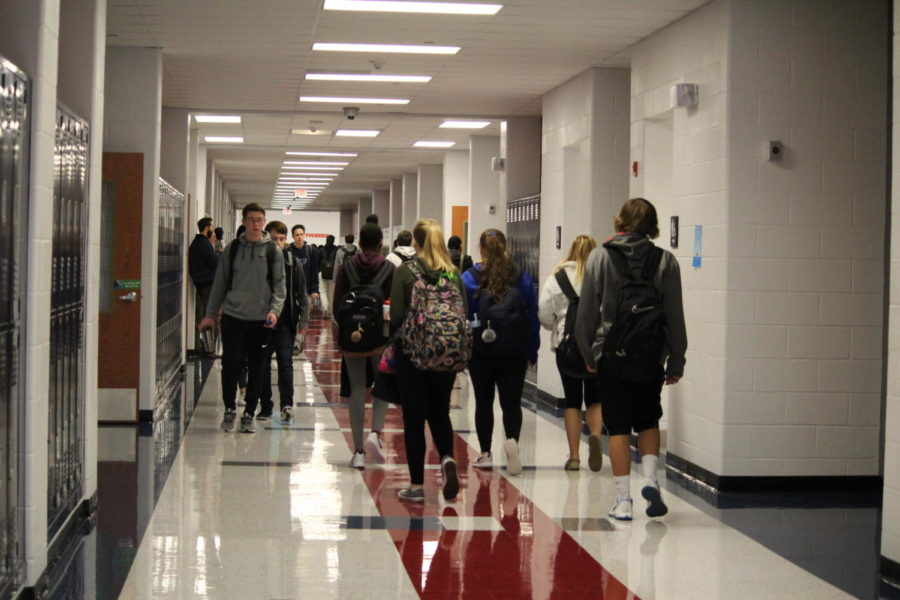 Students rush to class after the warning bell