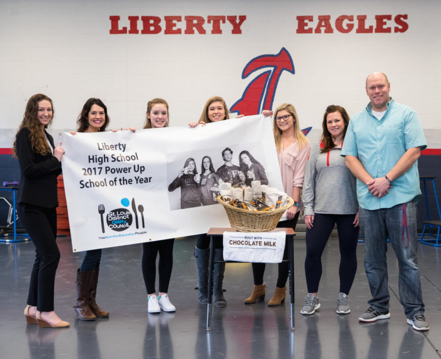 After being named the Power Up school of the year, Liberty was awarded with a grant to purchase chocolate milk, a banner, gift basket and a photo to hang in our very own gym. 