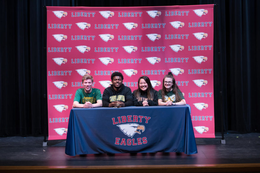 From left to right: Seniors Lucas Mitchell, Wesley Hines, Maya Schnable and Claire Roberts gather to celebrate the start of their college sports careers on National Signing Day, Wednesday, February 7th. 