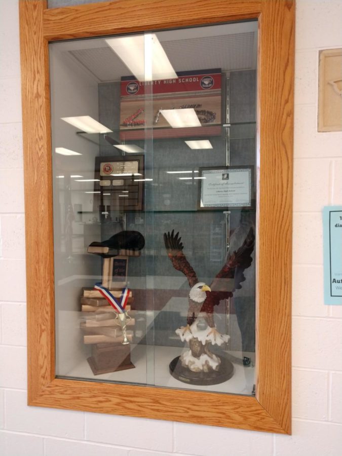 The Battle of the Books trophy sits in the trophy case in the main entrance of the school.