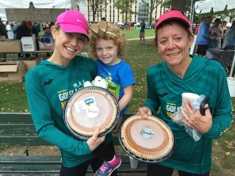 Mrs. Hall and her mother Beth Pirtle both won their respective age divisions in the St. Louis Go Halloween Race in St. Louis. Mrs. Hall holds her daughter Gwyneth. 
