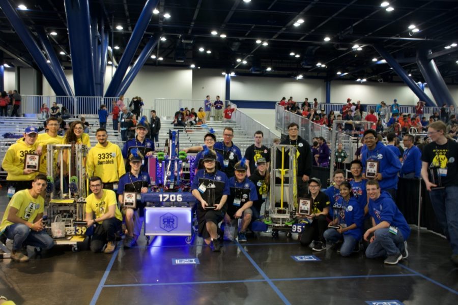 Team 1706 poses with their alliance partners: 3339 BumbleB, 2774 Walton Robotics and 957 Swarm, with their awards for being Finalists in the Hopper division.