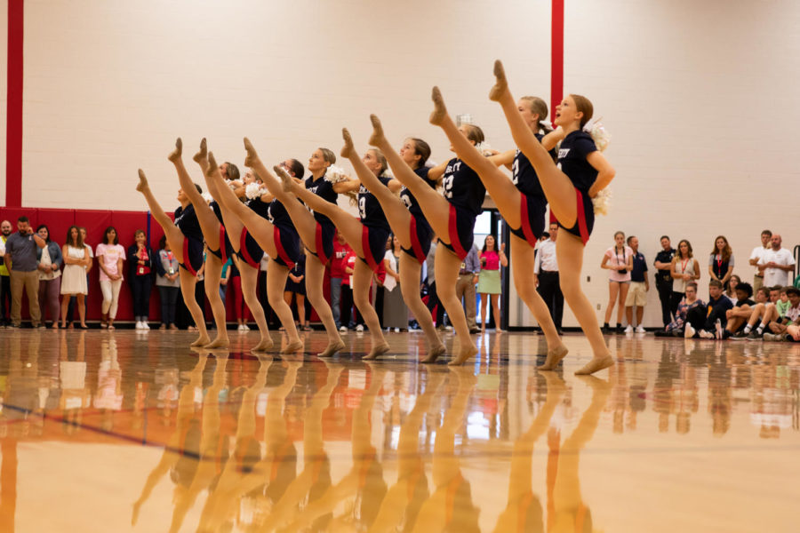 The dance team performs for the crowd at the first-day of school assembly. 