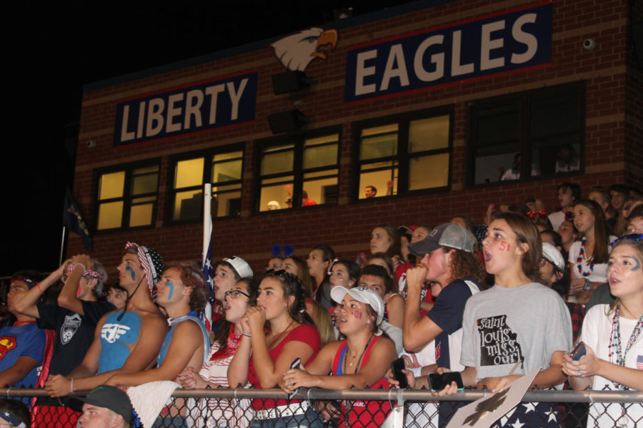 After Warrenton rallied late in the fourth quarter to make it a one possession game, the student section anticipates a close finish. A defensive stop in the closing minute sealed the Eagles 20-13 victory. 