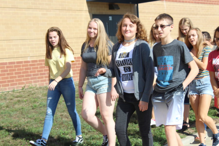 Freshman Piper Abernathy, Madison Pegg, Shaunna Cruise walking on the first day of school.
