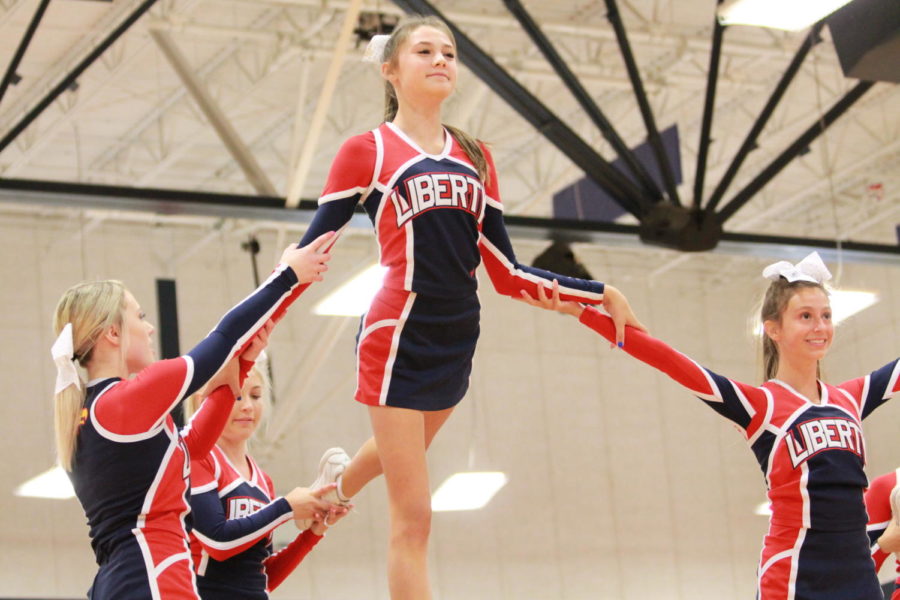 Cheerleaders perform in front of the crowd at the annual first day assembly.