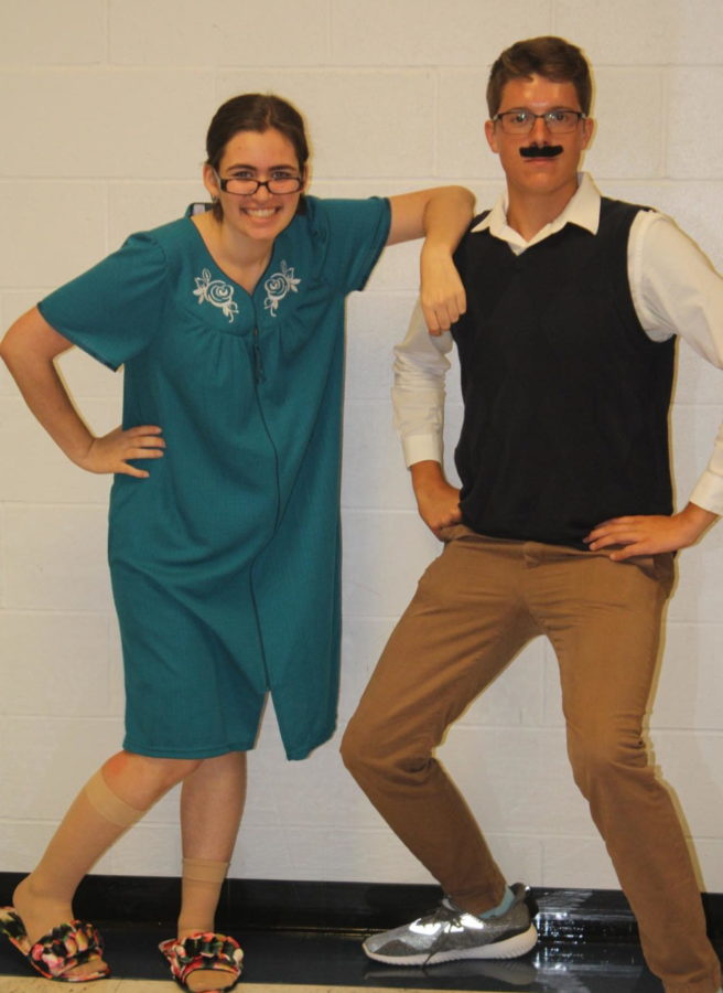 Senior Emily Stabile and junior Zach Kerns take part in Generation Wars, where seniors dressed as senior citizens, juniors dressed as parents, sophomores dressed as children and freshmen dressed as infants. 
