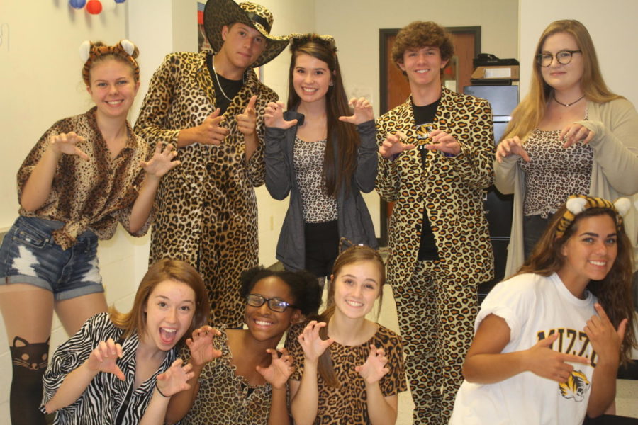 Student Council poses fiercely as they are decked out, head to toe, in animal print. 
