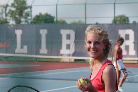 Carly Torbit prepares for her doubles match against Holt. She is a freshman on varsity tennis.
