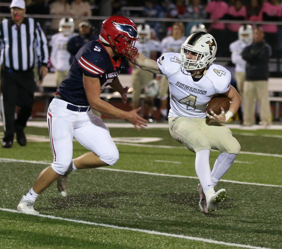 Grant Baker rushes  the Holt running back. Liberty hosts Francis Howell North on Friday. 