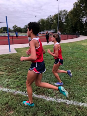 Adrienne Rockette and Megan Venturella compete at the conference meet at Washington. 
