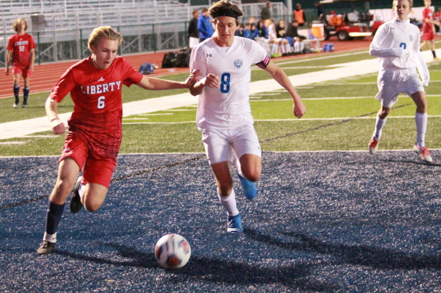 Junior Joey Mesnier dribbles around a defender from Washington. Liberty won the game 3-1 to improve to 14-7 on the season. 