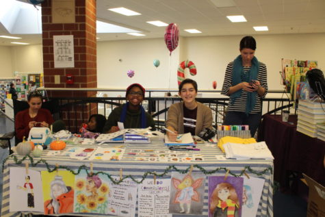 Ayrianna Franklin (left) and Sara Bailey (right) are shown selling their art at the Holiday Bazaar on Nov. 10.