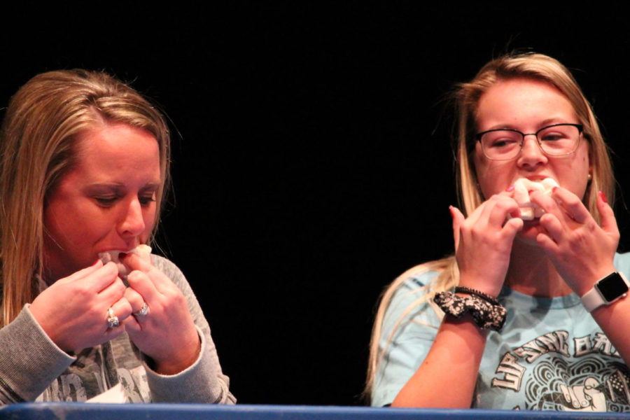 Lilly Lankford (12) and Mrs. Clark go head-to-head in a game to fit as many marshmallows in there mouth as possible. “I deserve a recount because I don’t think Mrs. Clark had more than me,” Lankford said. Mrs. Clark works in the office with attendance and parking passes.