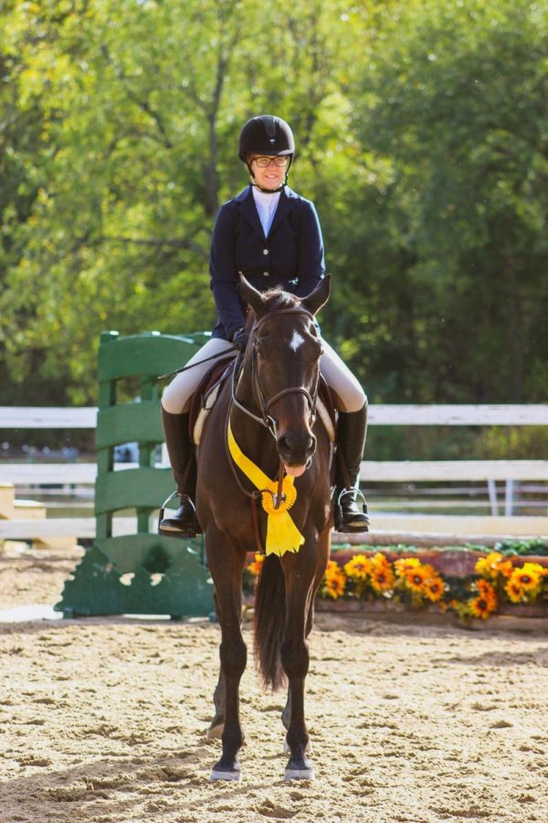 Senior Hannah Gamble with her horse at a show over the 2018 summer.