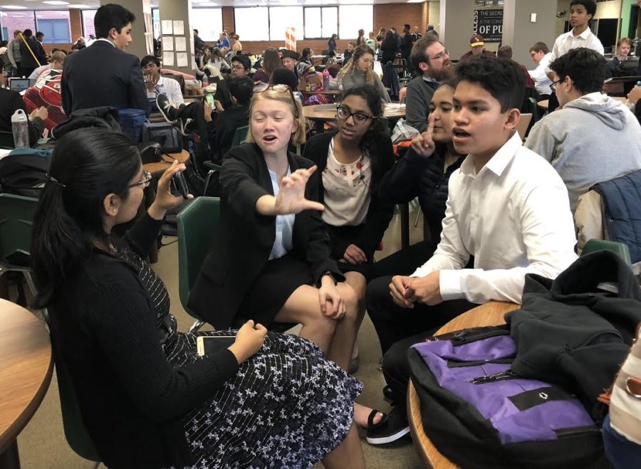 The speech and debate team bonds over their first tournament while waiting for round results.