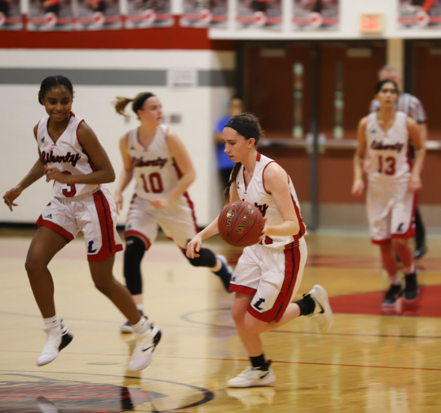 Sara Gordley dribbles down the court in a game at the Warrenton Tournament. 