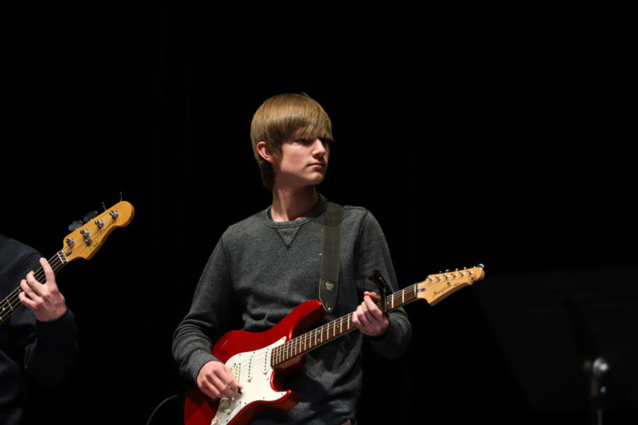 Senior Colin Rice plays the guitar for senior Mykaela Reiland and junior Emily Gann.
