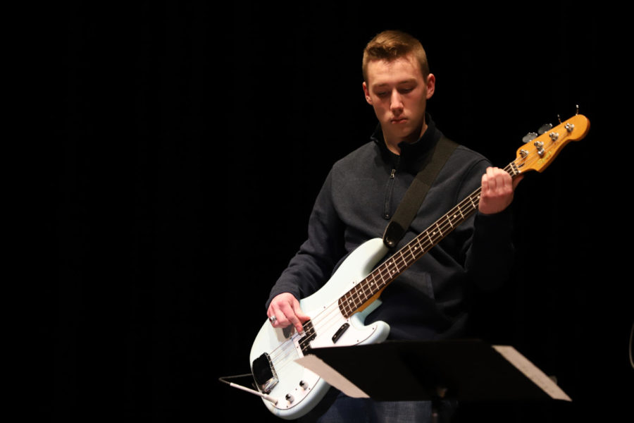 Senior Alex Vigor plays the bass guitar for senior Mykaela Reiland and junior Emily Gann.