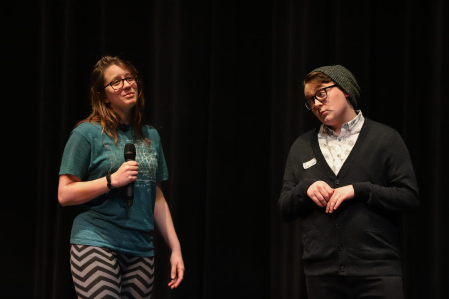 Seniors Cat Frank (left) and Paxton Linnemeyer (right) sing together.