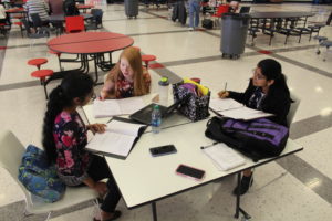 Mahathi Manikandan, (left) Maddie Sanderson, (middle) and Sanjana Anand, (right) prepare for their upcoming debate events. 
