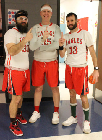 Mr. Cole (center) joins Mr. Schumacher (left) and Mr. Walterbach (right) on Tuesdays jersey day. Cole won the title as the most spirited teacher at the spirited week pep assembly.