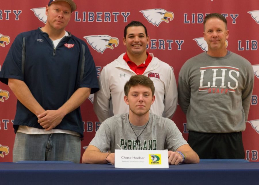 Senior Chase Hoeber signs his letter of intent at Parkland College on Nov. 14 as part of National Signing Day.