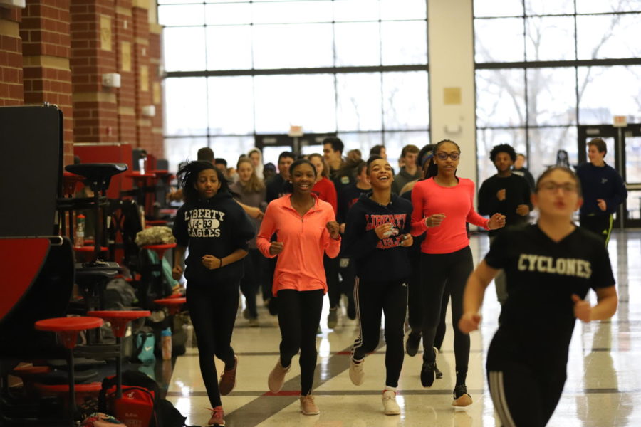 The track team warms up inside due to frigid temperatures to start the season. 