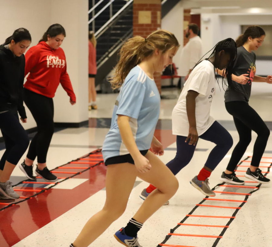 Soccer athletes get their footwork drills done inside. Cold weather has forced many practices to take place indoors.