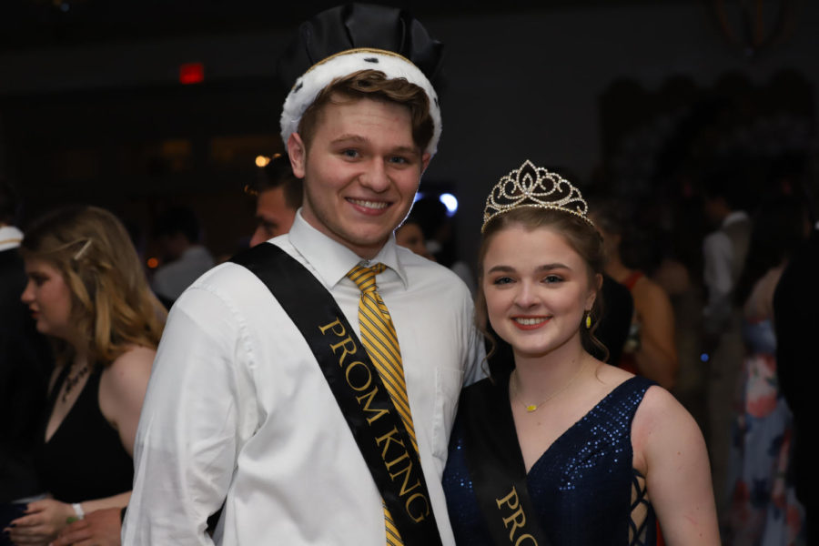 Seniors Hunter Perkins and Brittanie Tabers smile with their crowns after winning senior prom king and queen.