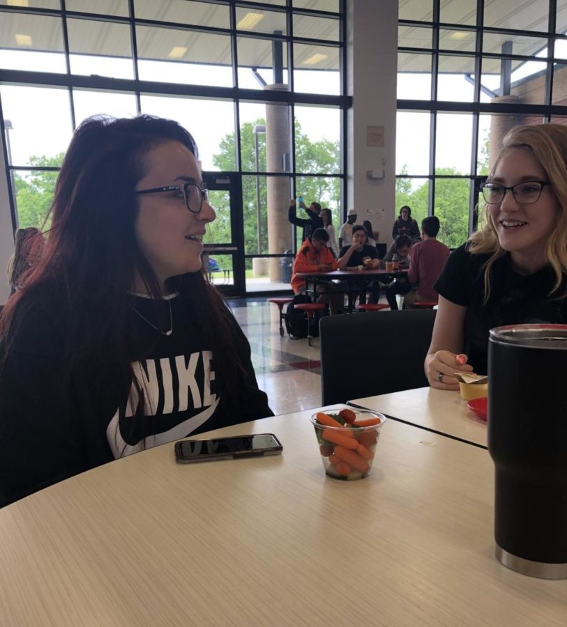 Kelsey Smoot and Kaylee Williams sit and talk at lunch. 