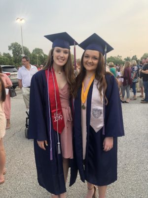 Jessica Gibson (left) and her friend of 15 years, Timberland senior Emerson Cicotte, graduated on June 2 at St. Charles Family Arena.
