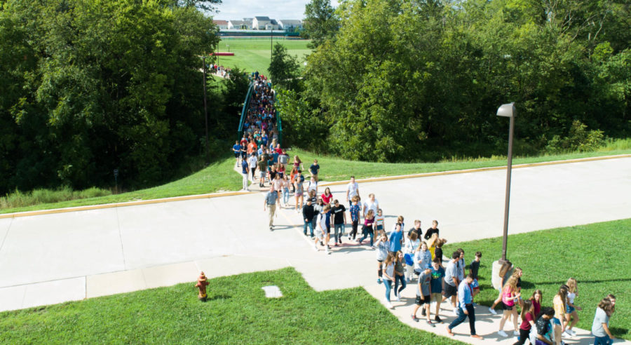 Freshmen walk into a new chapter of their lives as they complete the bridgewalk on the first day of their high school experience Aug. 13. 