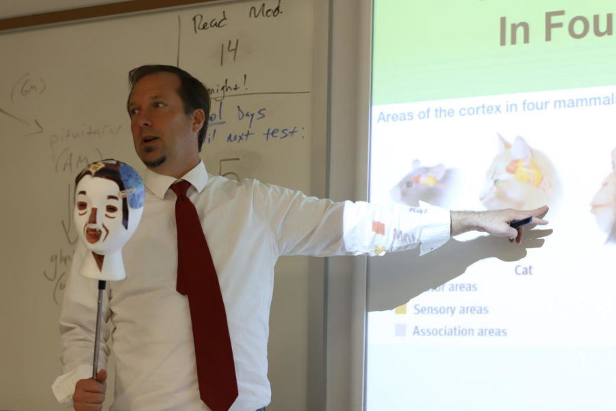 Mr. Barker adds fun, interactive elements to his lectures, capturing the attention of his students.