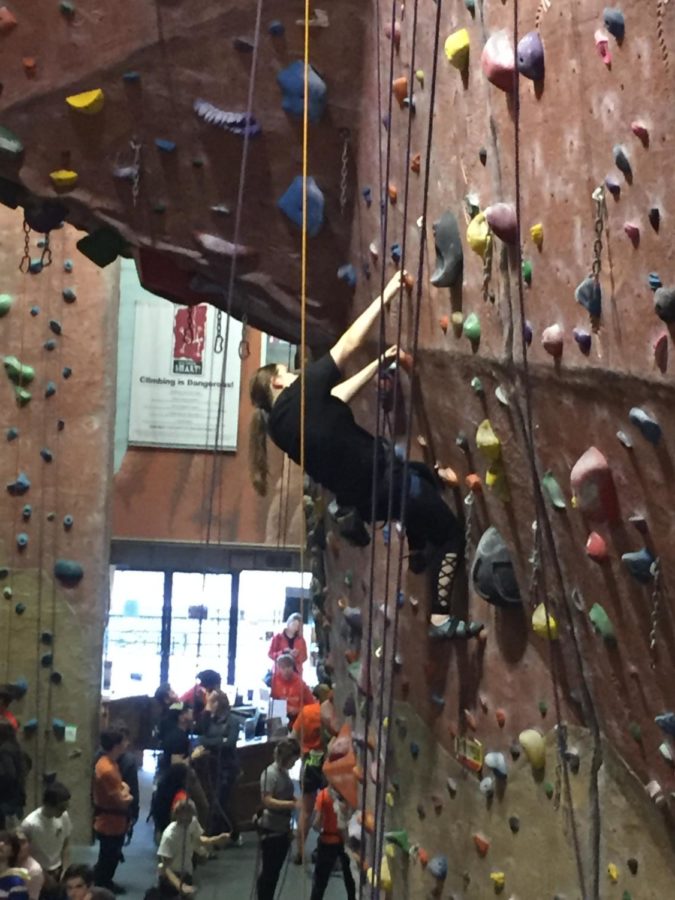 Cassie Tarrant is focused on completing a top-rope route for a school competition at the Upper Limits Rock Climbing Gym in downtown St. Louis.