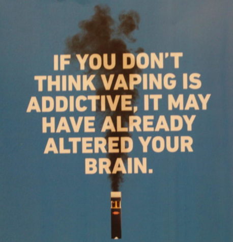 A poster describes one of the effects of vaping. 