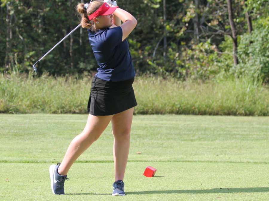 Madeline Francis tees off at her during a match.