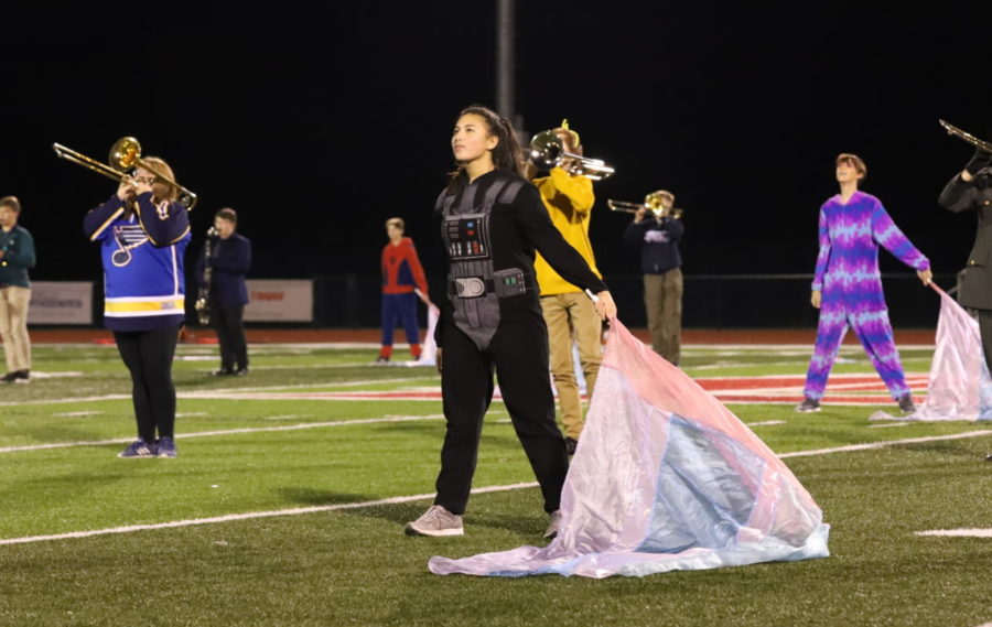 Julia Amery wears a Darth Vader onesie during her performance.