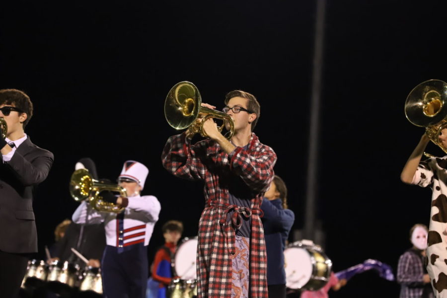 Tanner Waid plays the mellophone dressed up as 