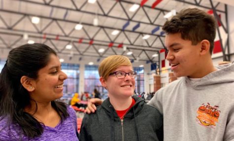 Sanjana Anand (left) and Jaden Zelidon (right) remind their friend Anna Morrison how much she means to them.