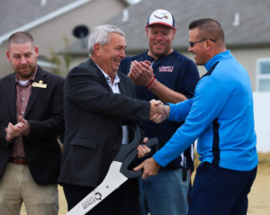 Mr. Nelson cuts the ribbon with OFallon mayor Bill Hennessy to celebrate the completion of the Paul Renaud Blvd. Extension project Nov. 6. 